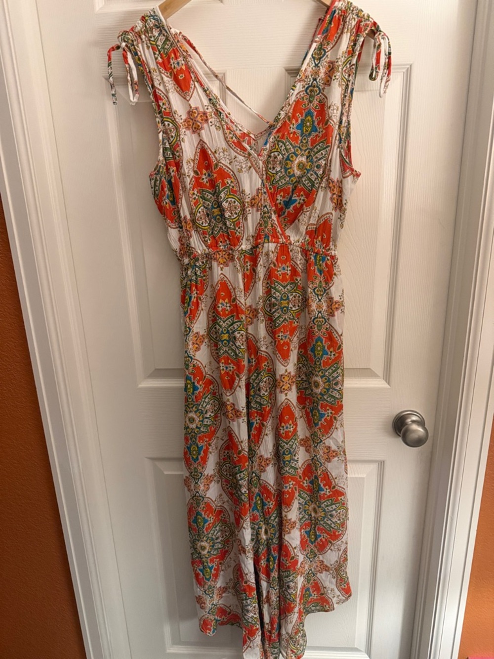 Sleeveless White Jumpsuit with Orange & Green Paisley Print